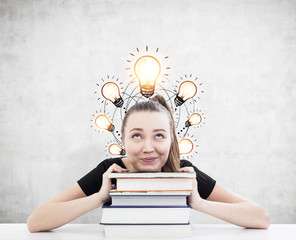 Woman with ponytail, books and seven light bulbs