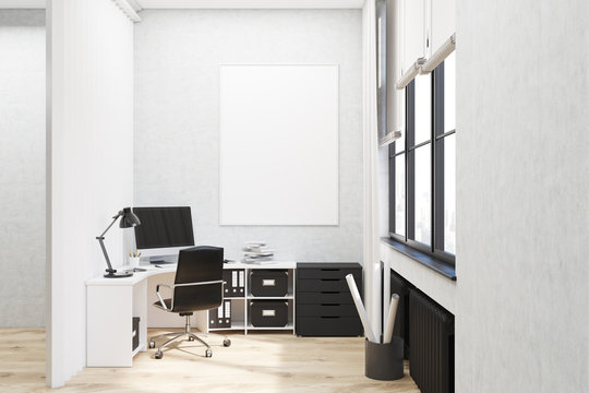 White walled office with poster
