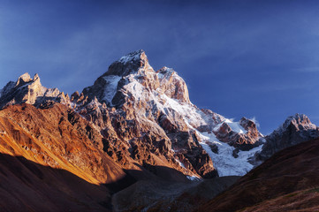 Fantastic scenery and snowy peaks in the first morning sunlight.