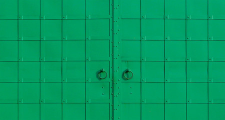 Metal gate painted in green.