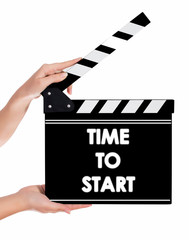 Hands holding a clapper board with TIME TO START text