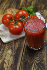 Raw Organic red Tomato Juice with salt, basil and bread