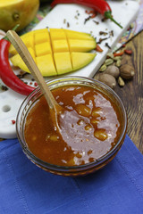 Bowl of homemade Mango Chutney on old wooden table