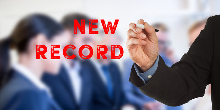 New record, Business man hand writing with team