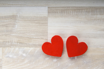 two hearts on white wooden background