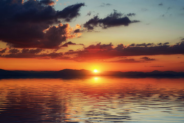 Sunset over the sea, the coast.