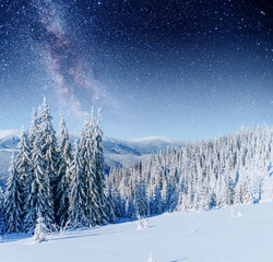 Fototapeta na wymiar fantastic winter meteor shower and the snow-capped mountains. Ca