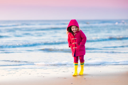 Child on North Sea beach in winter