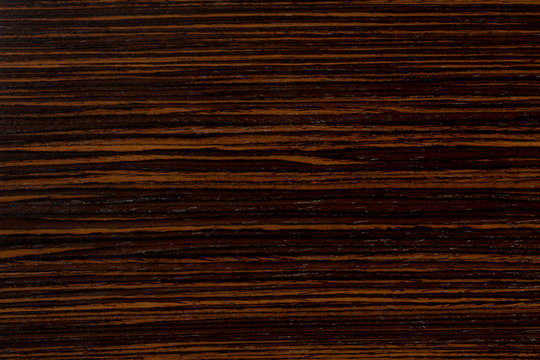 Dark ebony wood background, exclusive natural texture with patterns.