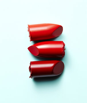 Three lipstick ends in a row, white background