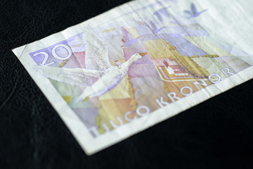 Obsolete Banknote in twenty Swedish kronor on a dark background