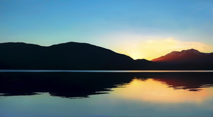Sunset on Te Anau lake in New Zealand. A beautiful summer evening.