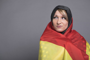 Beautiful woman wrapped in the German flag