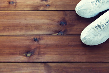 close up of sneakers on wooden floor