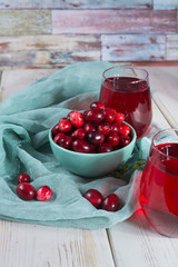 Fresh cranberries in a blue bowl. Ripe berries of Vaccinium macrocarpon, also large cranberry, American cranberry or bearberry.