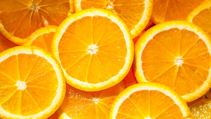 background made of sliced juicy oranges
