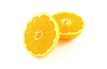 Two halfs of mandarin fruit on white background. Fresh and heath tropical citrus fruit.