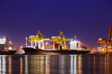 Fototapeta na wymiar Container cargo freight ship at port twilight