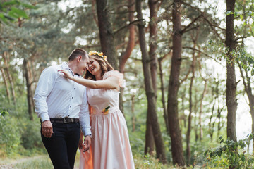 Happy couple in a pine forest Beauty world