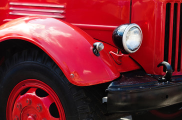 Vintage red car headlight, black wheels truck Retro transport concept photo