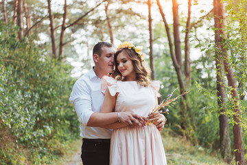 Fototapeta premium Walk a happy young couple on the nature