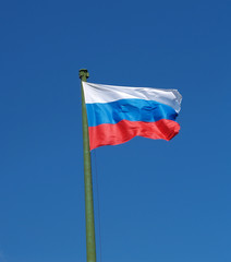 Fototapeta na wymiar Flag of Russia against the blue sky