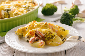 Casserole with fish (salmon), potatoes and broccoli.