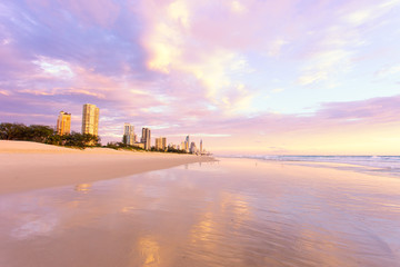 Fototapeta na wymiar Surfers Paradise sunrise reflections on Queensland's Gold Coast in Australia