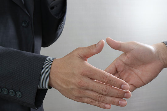 Business partnership meeting concept.photo businessmans handshake. Successful businessmen handshaking after perfect deal.close up