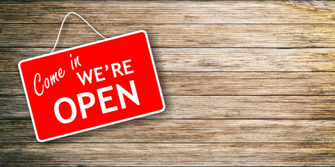We are open sign on wooden background
