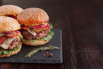 a delicious and juicy burger home in a rustic style with a big chop of beef