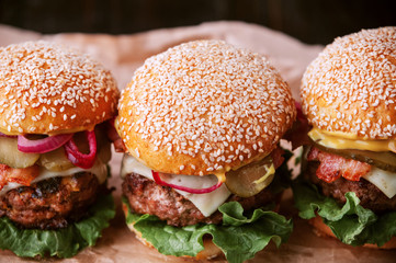 a delicious and juicy burger home in a rustic style with a big chop of beef