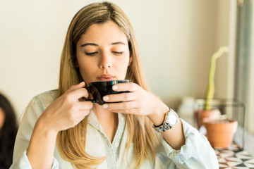 Woman drinking some coffee
