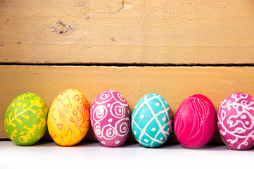 Closeup of beautiful Easter eggs with their hands. A festive mood.

