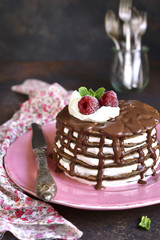Chocolate pancakes with mascarpone and chocolate sauce.