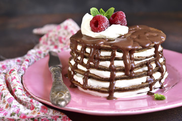 Chocolate pancakes with mascarpone and chocolate sauce.
