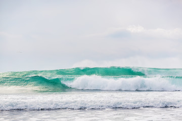 Naklejka na ściany i meble Blue waves in ocean. Waves for surfing