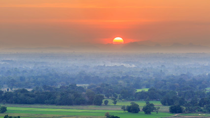 Sunset with rice filed in foreground