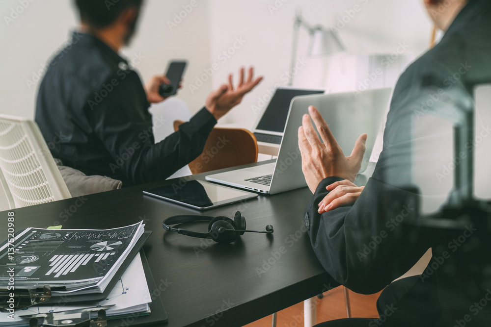 Poster co working meeting,two businessman using VOIP headset with laptop computer on desk in modern office as call center and customer service help desk concept 