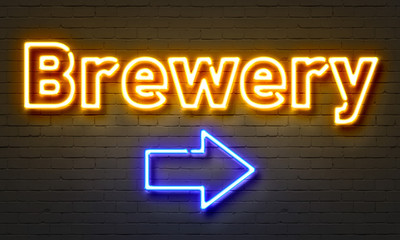 Brewery neon sign on brick wall background.