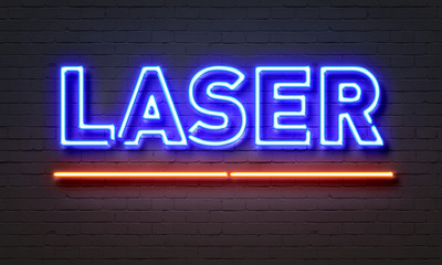 Obraz na płótnie Canvas Laser neon sign on brick wall background.