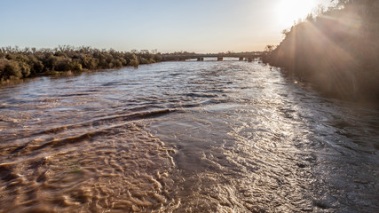 Looking towards Sunrise Boulevard from the Fair Oaks red footbridge with American River in flood