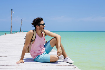 Young man traveling in Holbox island, Mexico.
