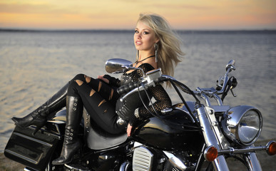 Fototapeta na wymiar Young beautiful woman and bike 