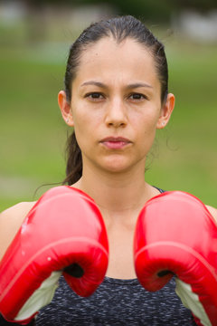 Young sporty attractive woman boxing outdoor