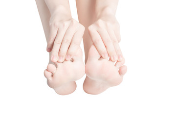 Acute pain in a woman feet isolated on white background. Clipping path on white background.