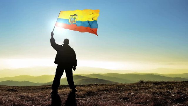Successful man waving Ecuador flag 