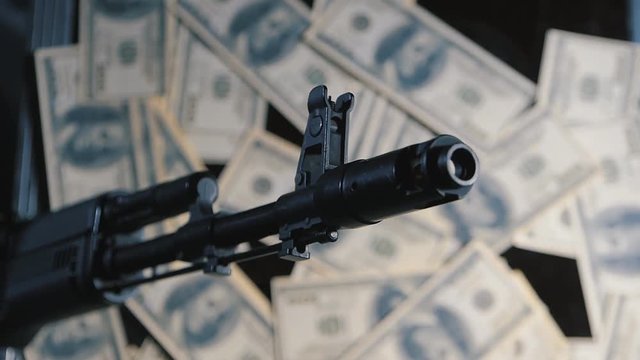 gun and money. the concept of the sale of weapons. wage the war
