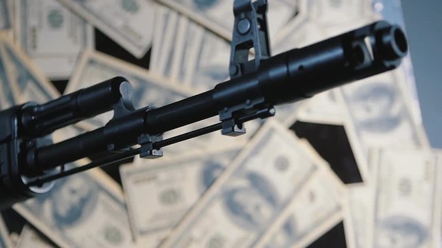 gun and money. the concept of the sale of weapons. wage the war