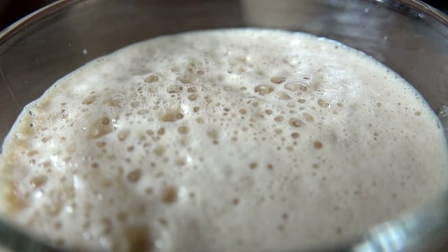 pouring coffee with cream foam
